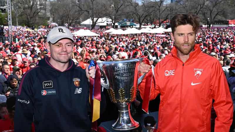 Lions fans roar as Swans fly high at grand final parade