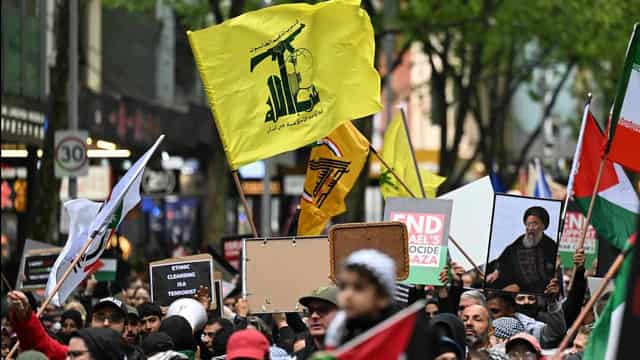 Protesters wave Hezbollah flags at Australian rally