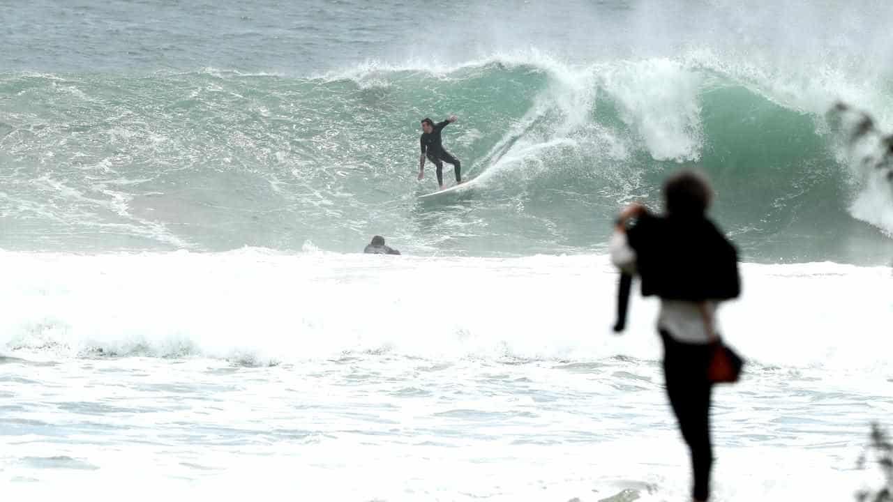 Flood risk downgraded as wild weather eases