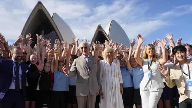 Thousands queue to but see the royals passing by