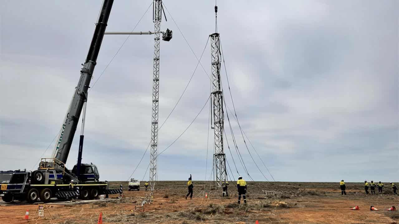 Workers build Broken Hill towers in power outage fix