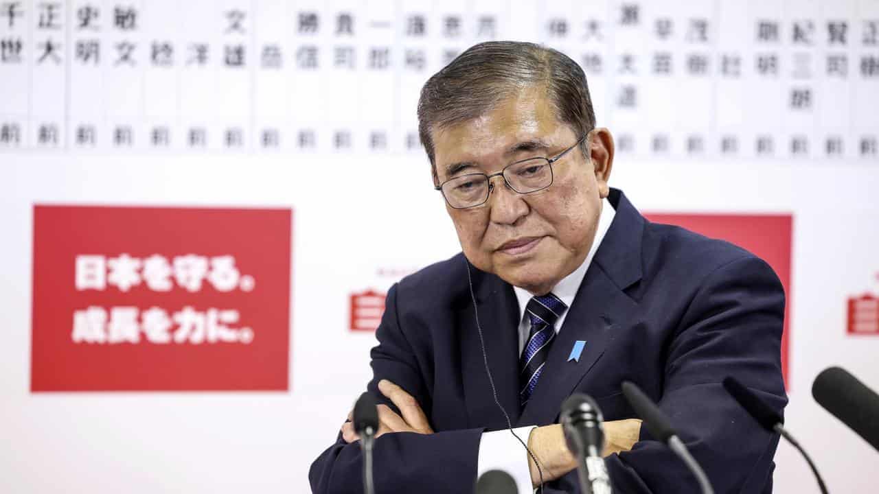 Japan's government in flux after hammering in election