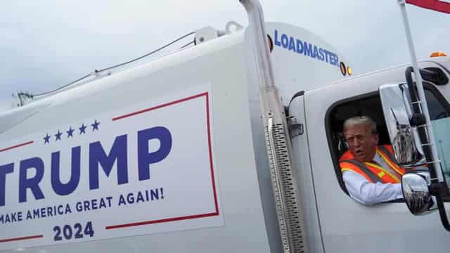 Trump boards garbage truck to highlight Biden comment