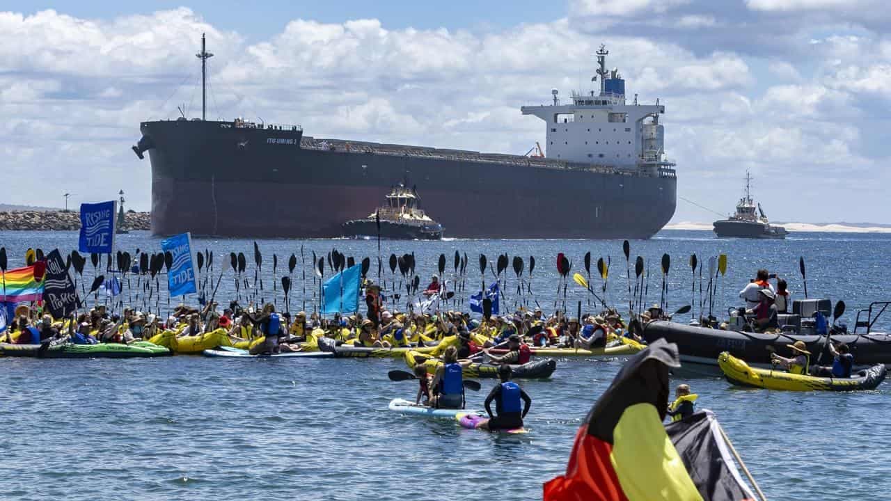 Protesters stop coal boats as more than 100 arrested