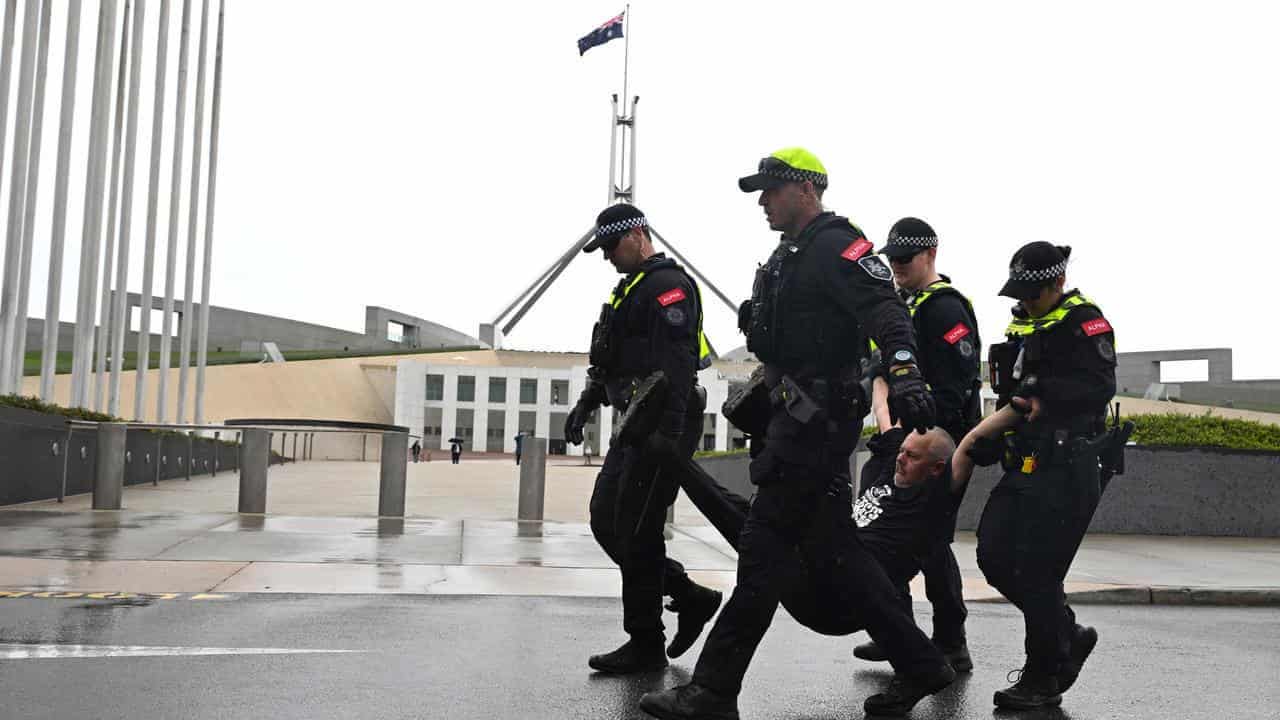 Moment climate protesters detained at parliament house