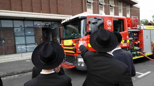 Synagogue arson attack sparks manhunt, security plea