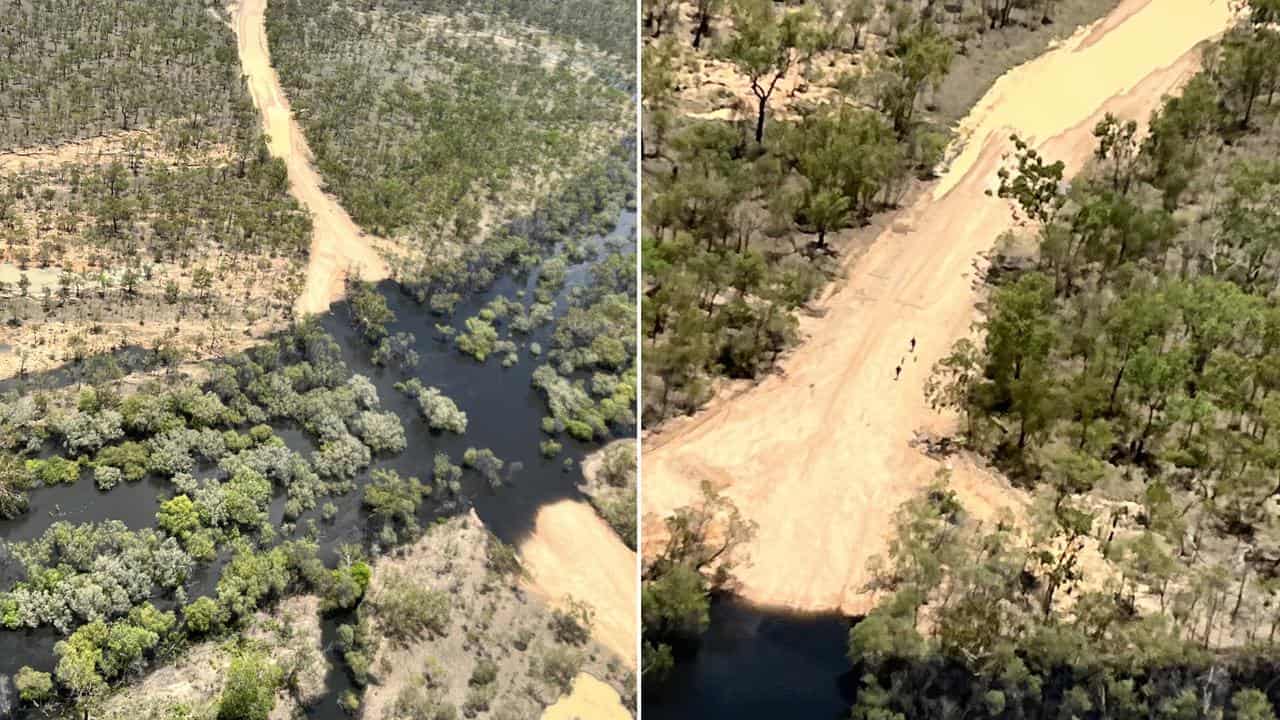 Couple stalked by giant crocodile after car washed away