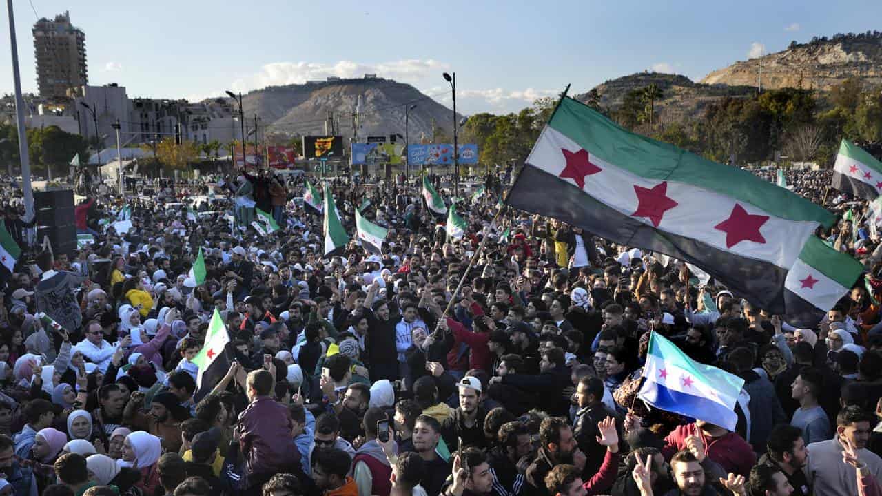 Thousands celebrate in Damascus after Friday prayers