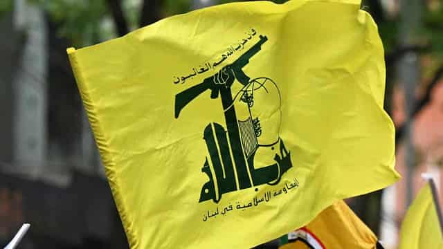 Protester charged for alleged display of Hezbollah flag