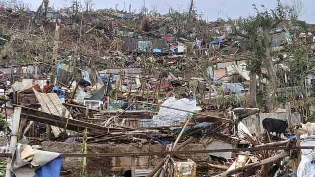 Rescuers race to find cyclone survivors in Mayotte