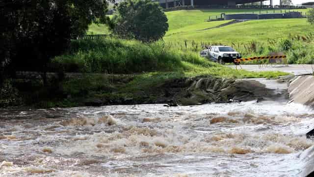 Two rescued as flooding rains move south