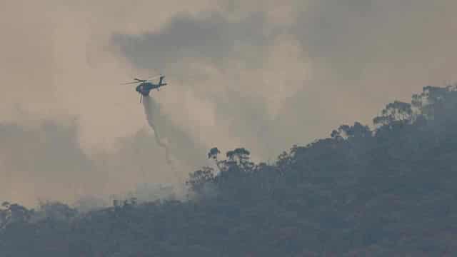 Bushfire rages but cool change a chance to check damage