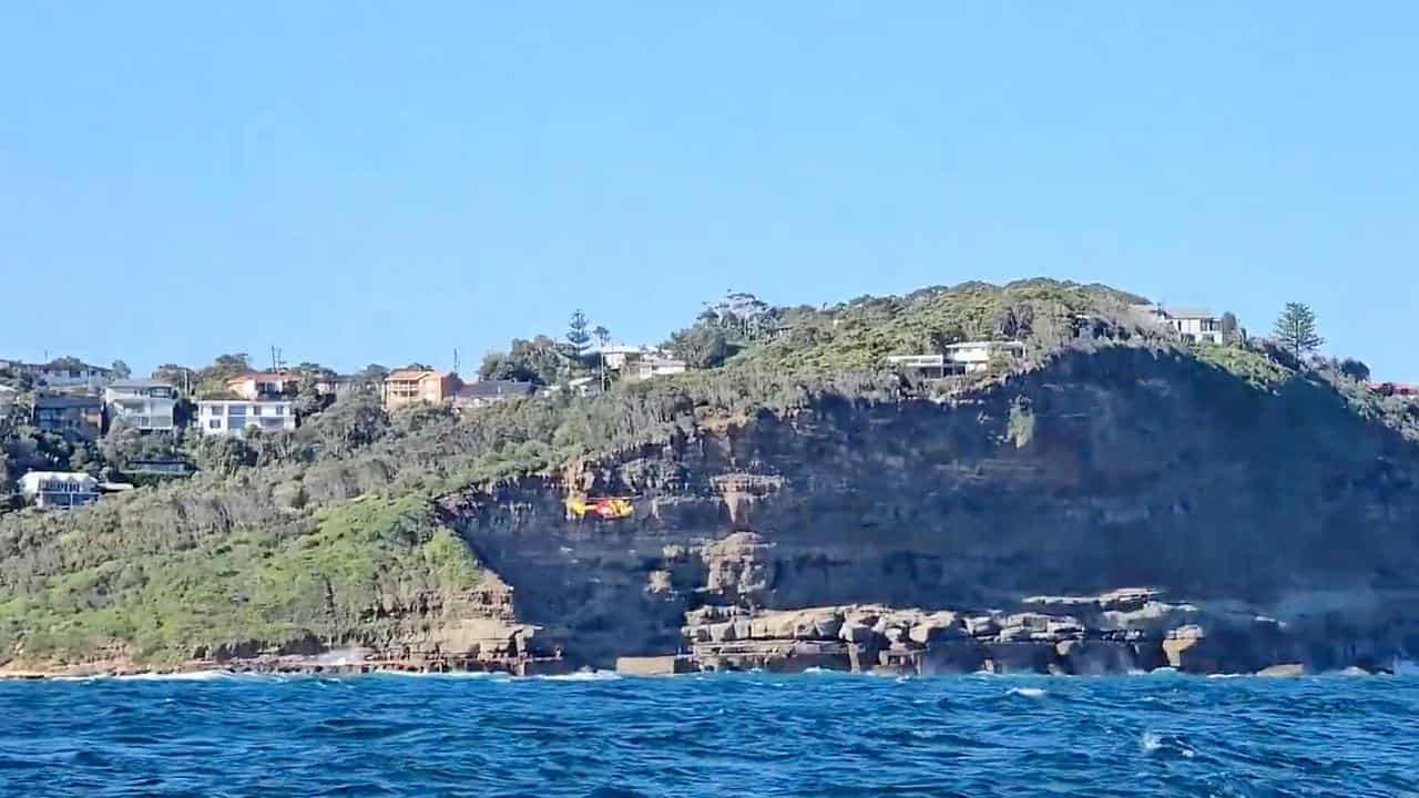 Grave fears for boy swept off rocks into sea