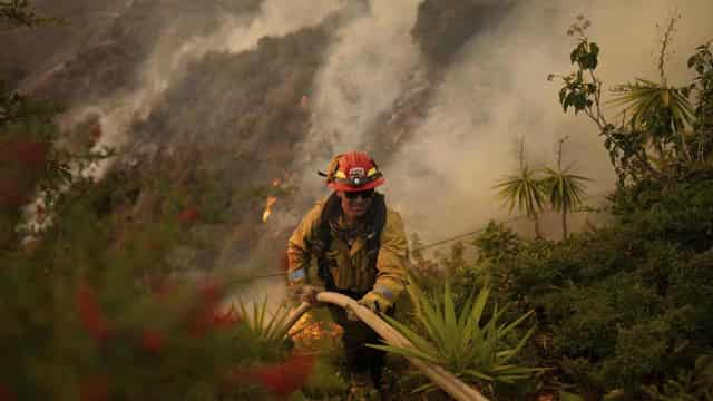 LA races to contain fires before extreme winds return