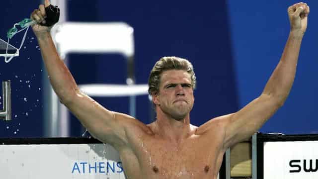 Replica Olympic medals given to fire-hit US swim great