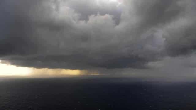 Cyclone off WA, flood search in NSW as Qld dams spill