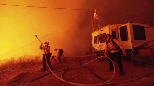 Fires fought as devastated Los Angeles picks up pieces