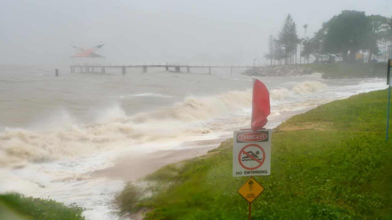 Woman dies in raging floodwaters as deluge continues