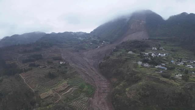 Rescuers search for 30 after a landslide in China