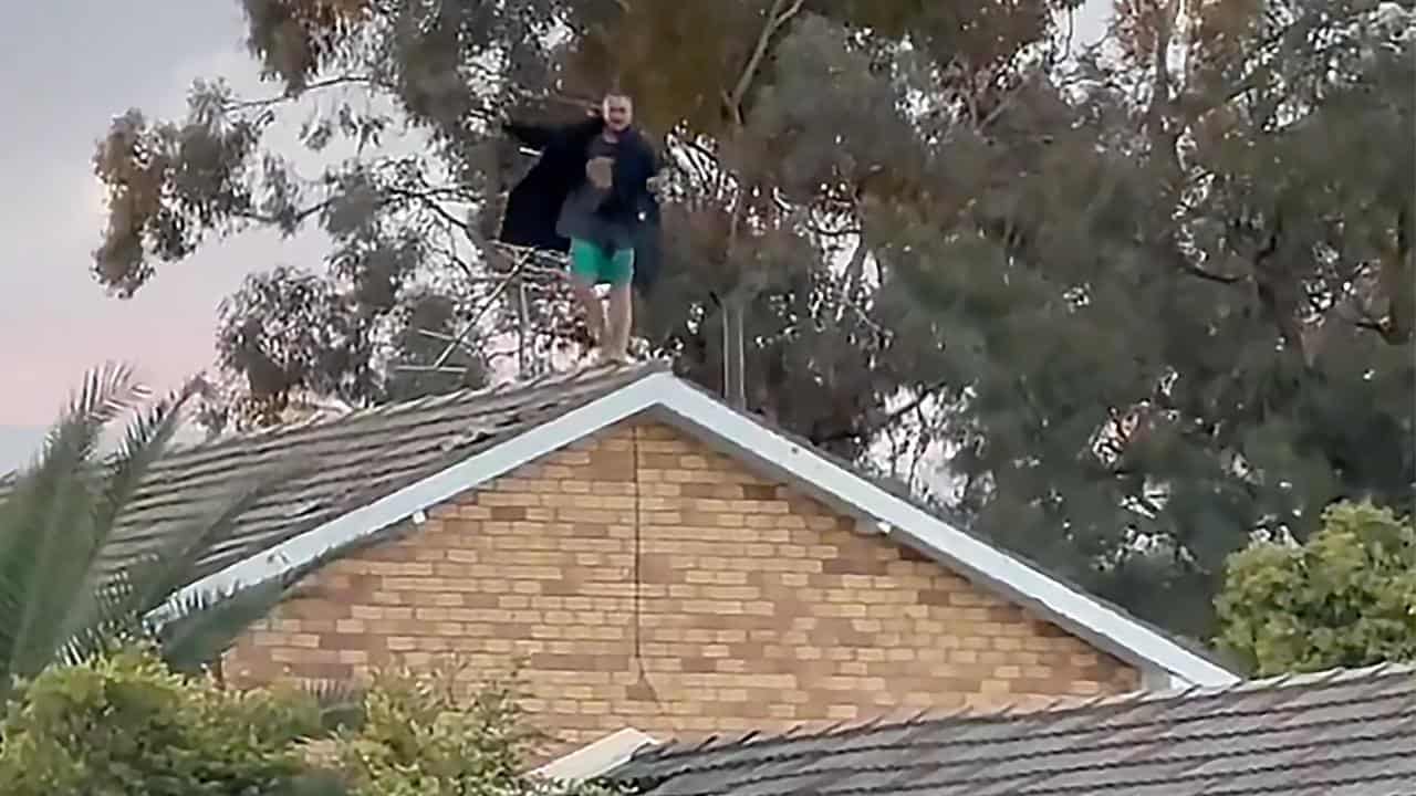 Probe into alleged murder after tense rooftop stand-off