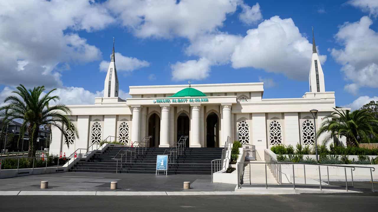Mosque unveiling tainted by alleged massacre taunt