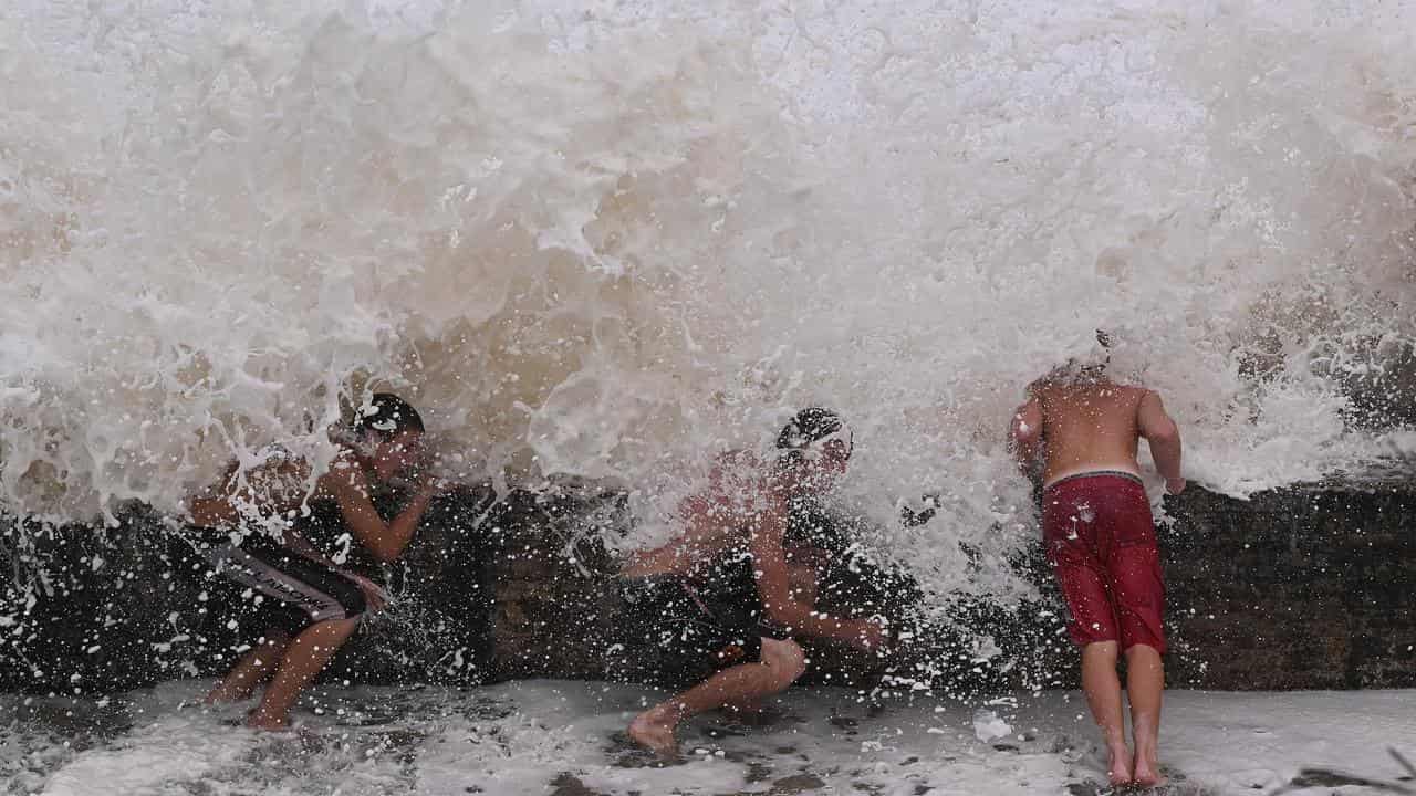 'Come already': millions bunker down ahead of cyclone