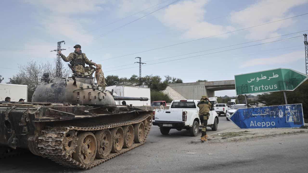 Syrian interim leader urges calm after massacres