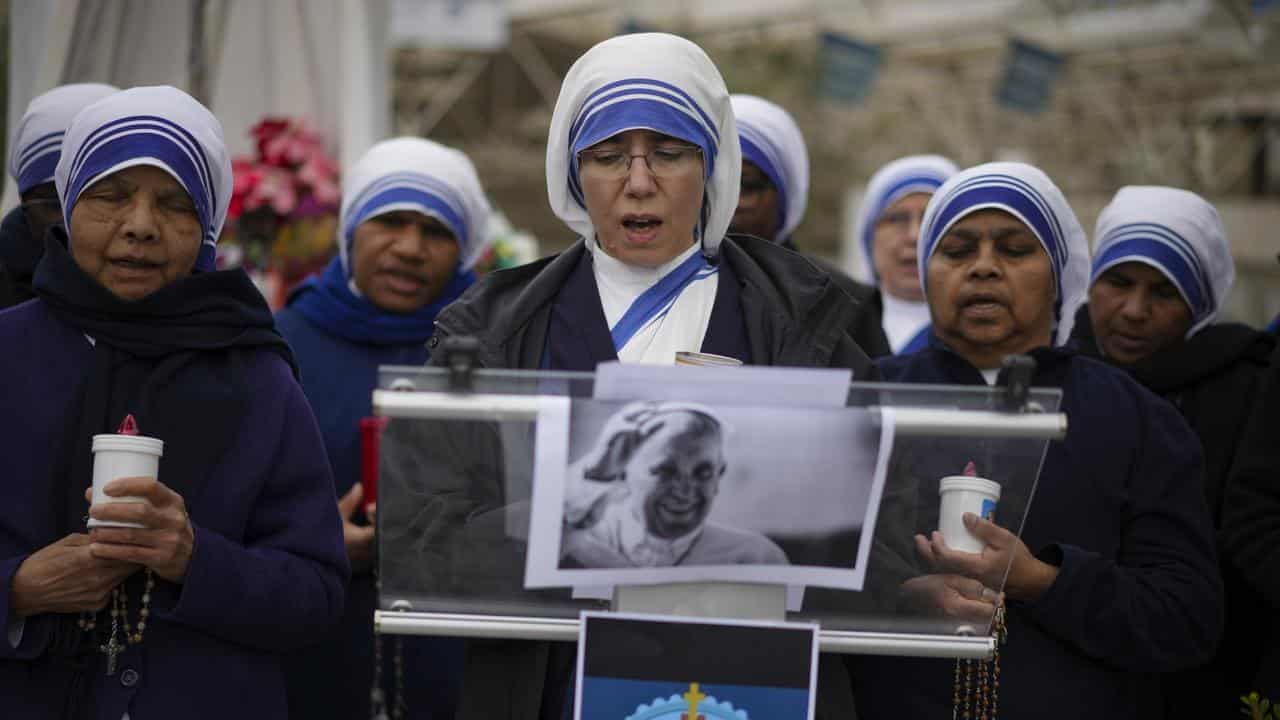 Pope follows Vatican's spiritual retreat from afar