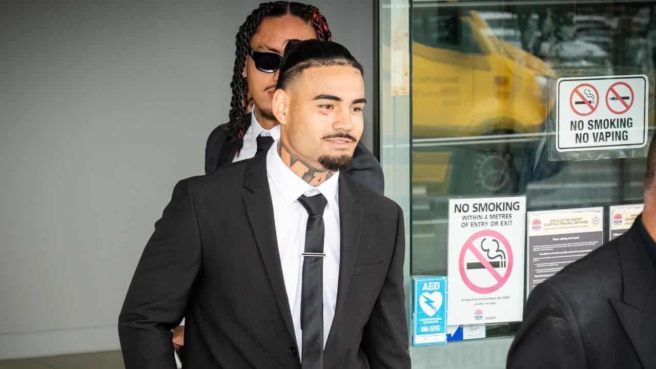 Smiling NRL star clear of DV charges after wife no-show