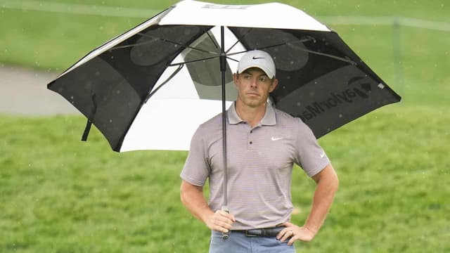 McIlroy leads as bad weather halts The Players