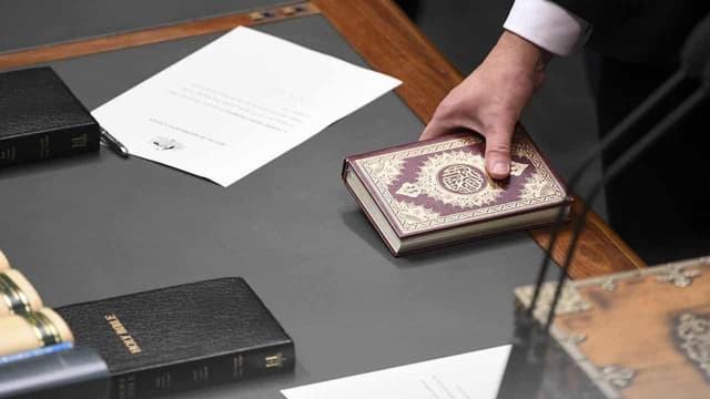 Constitution doesn't prevent MPs being sworn in holding Koran