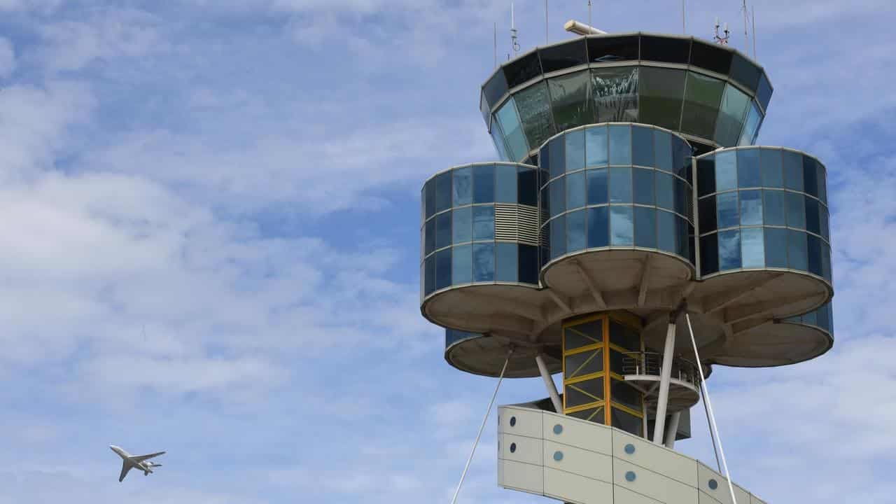 Passenger charged over alleged mid-air exit door scare