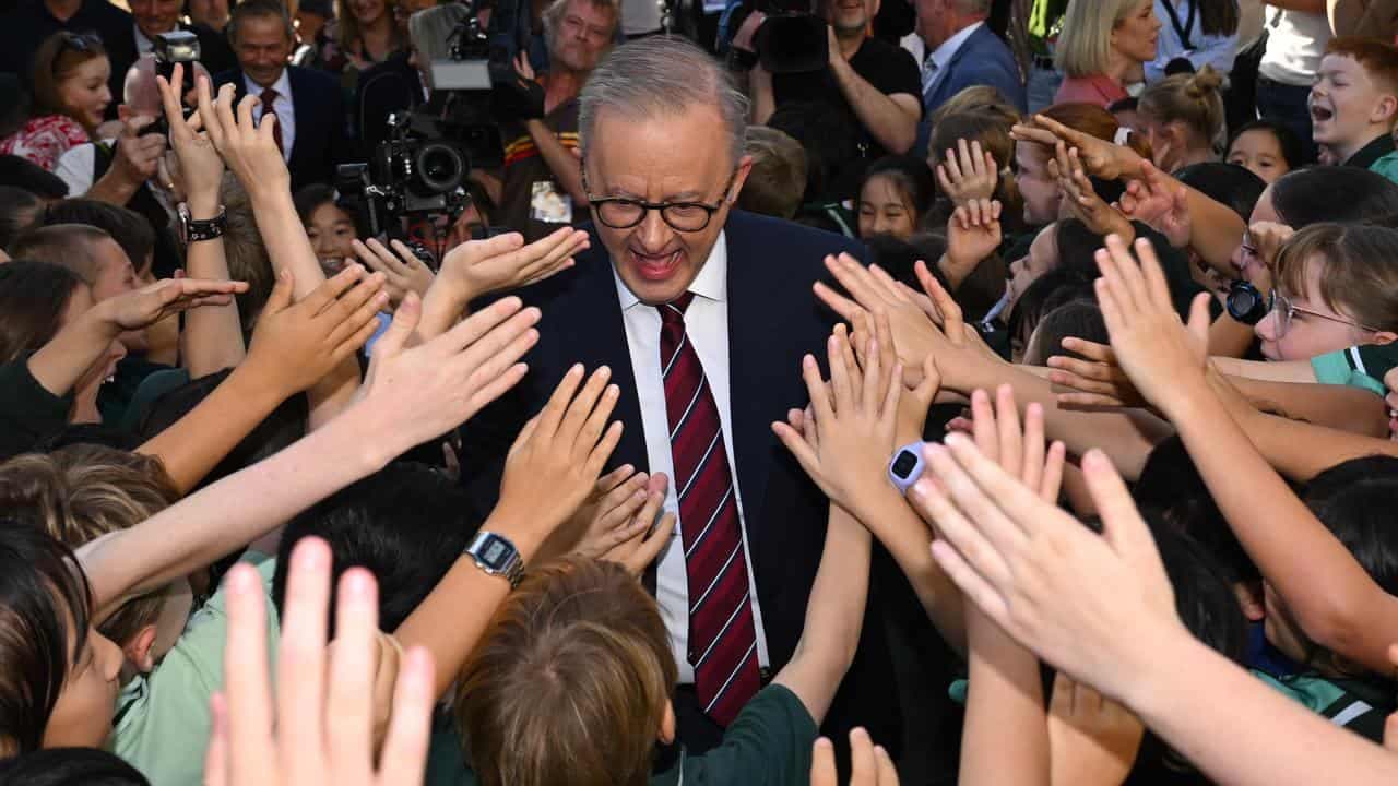 A for Albanese during uproarious school visit