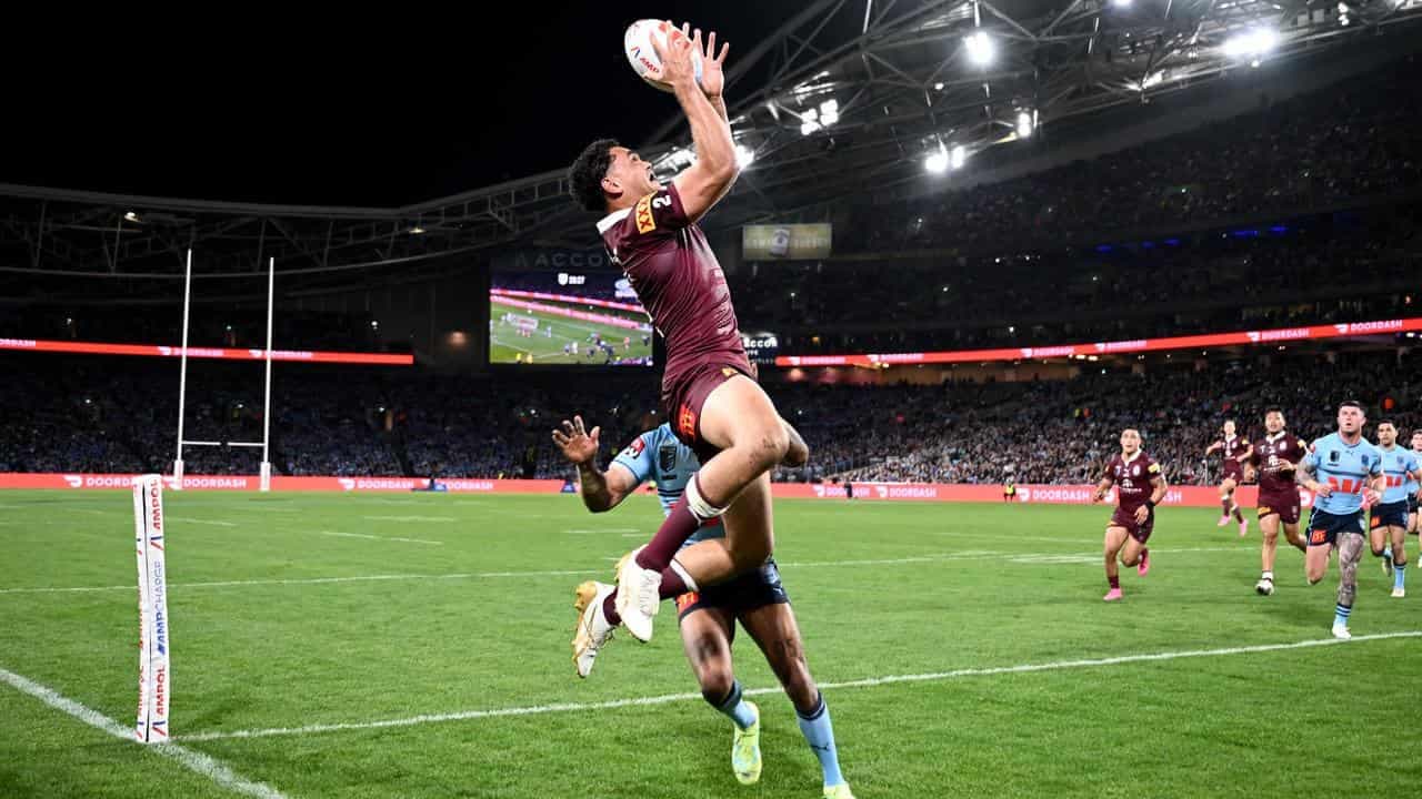 Coates floats high above To'o in Maroons aerial threat