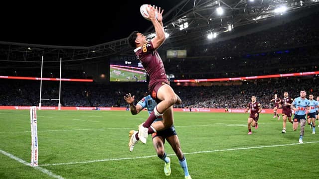 Coates floats high above To'o in Maroons aerial threat