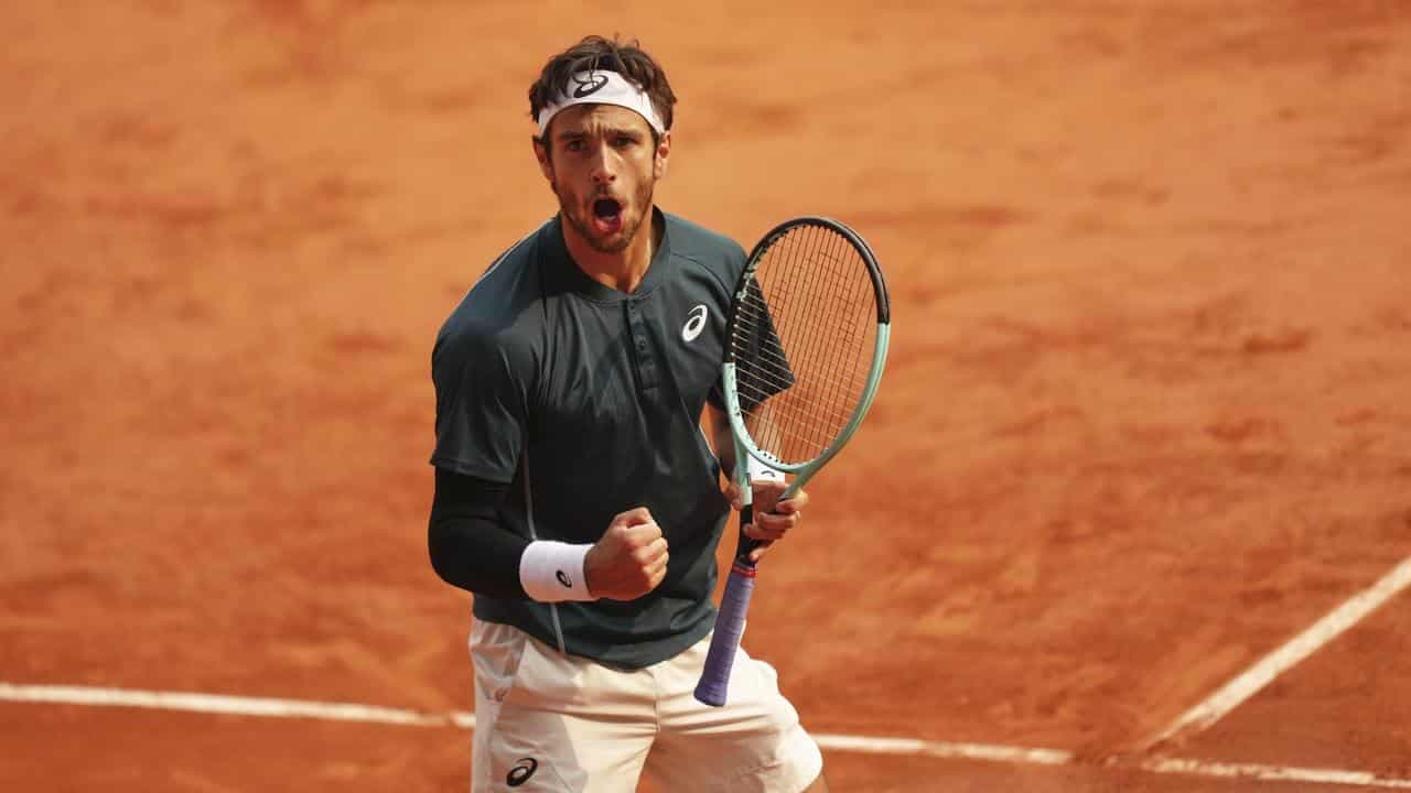 Musetti survives disqualification row to reach semis