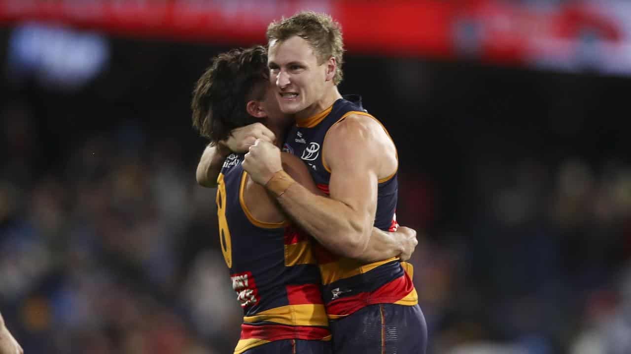 Comeback Crows' late surge sinks Brisbane in thriller