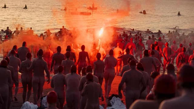 Primal moment: nudes brave icy waters for solstice swim