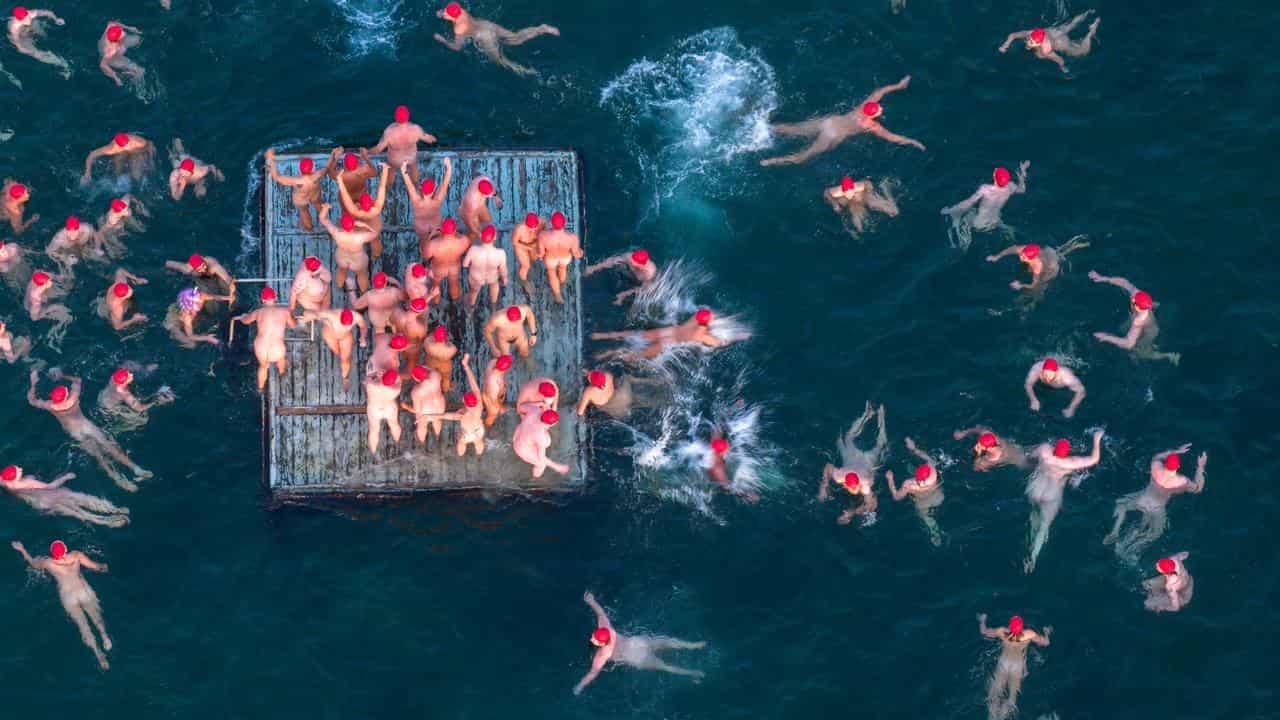 Nude swimmers brave chilly waters for solstice swim