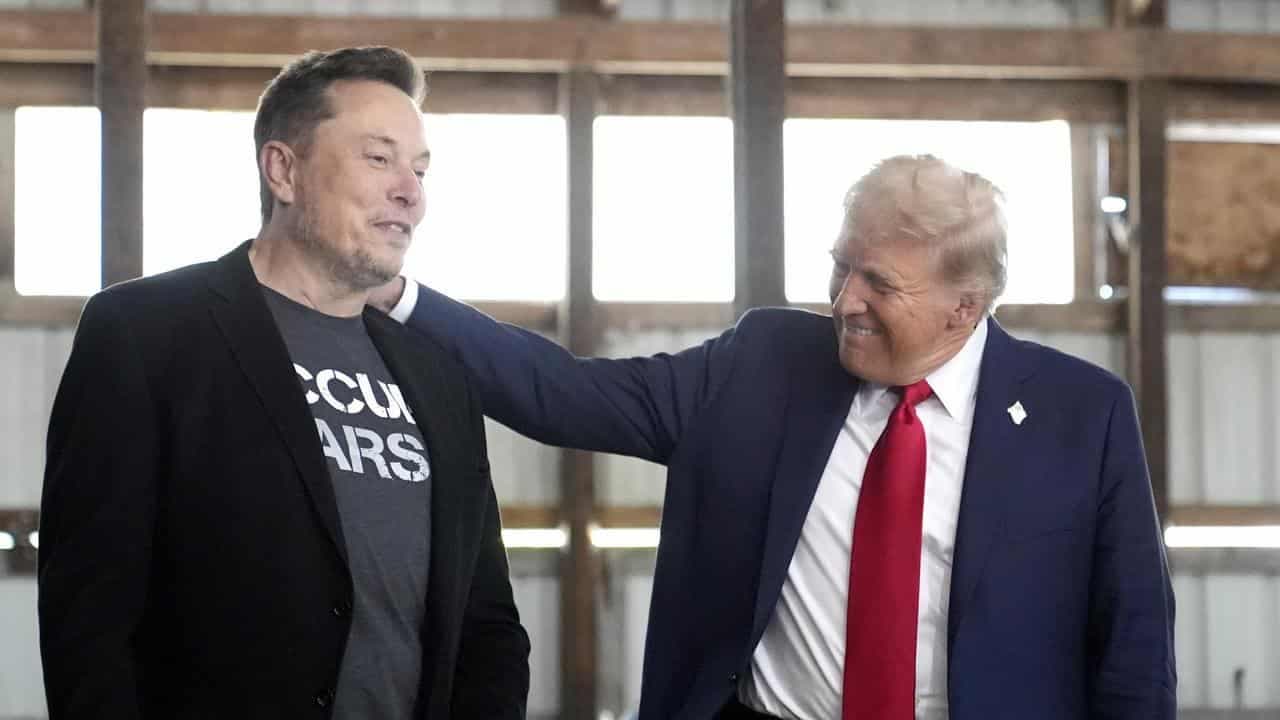 Trump escalates Musk feud with threat to Tesla support