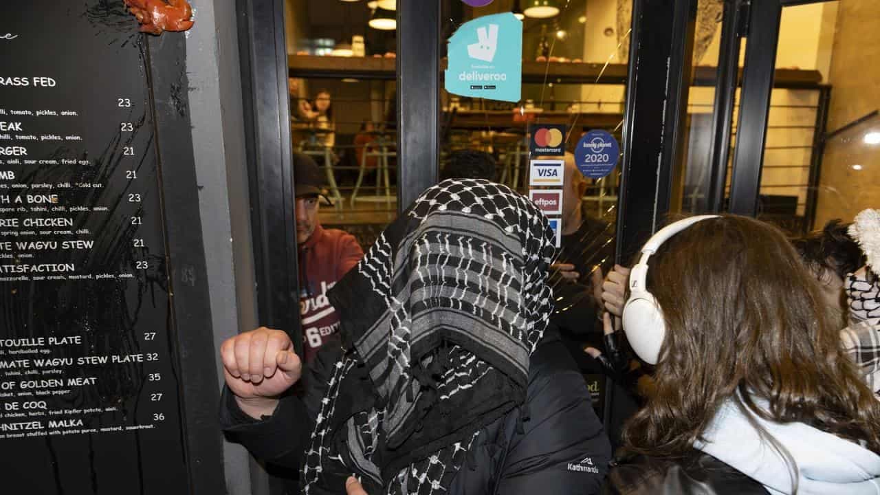 Charges laid amid restaurant's distress over protest