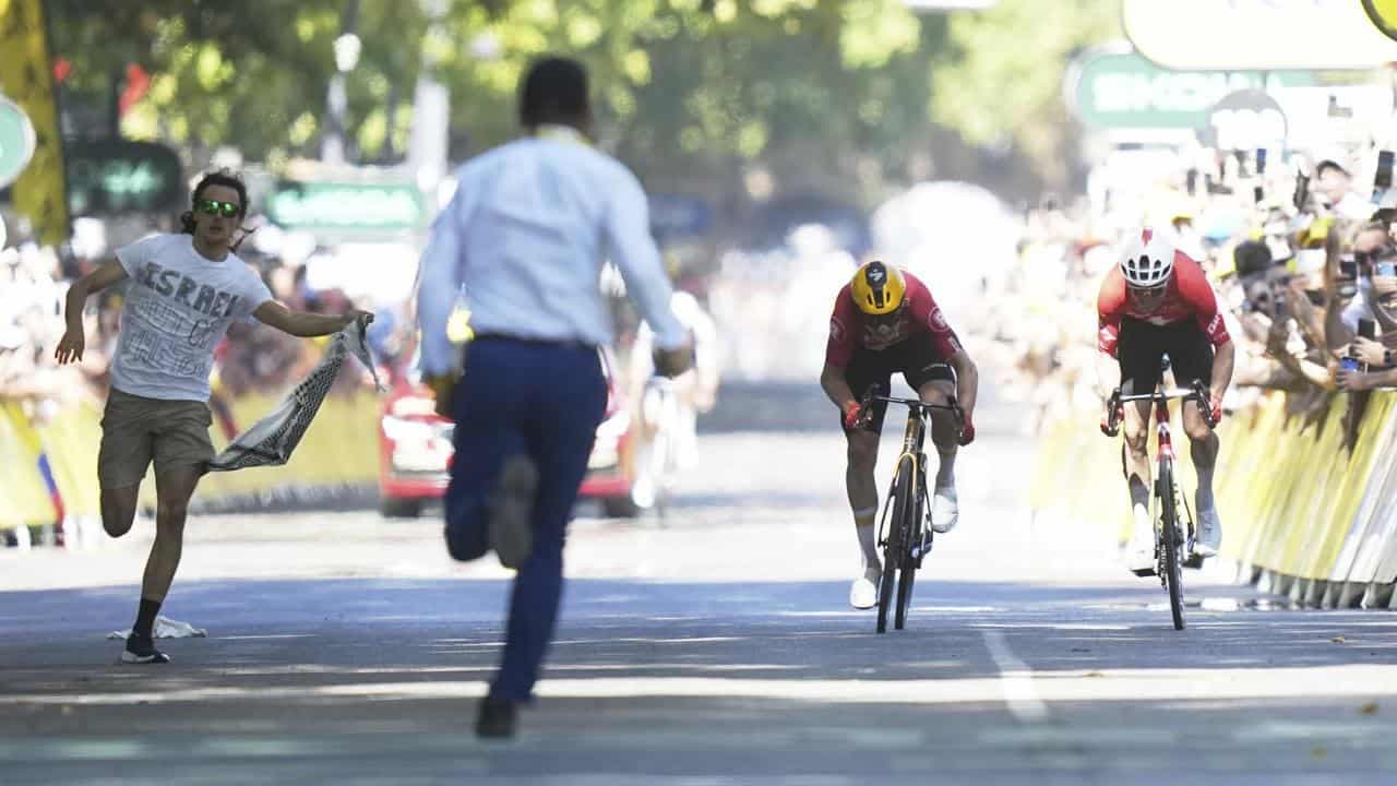 A protester, a crash and a near-miss for Jayco at Tour