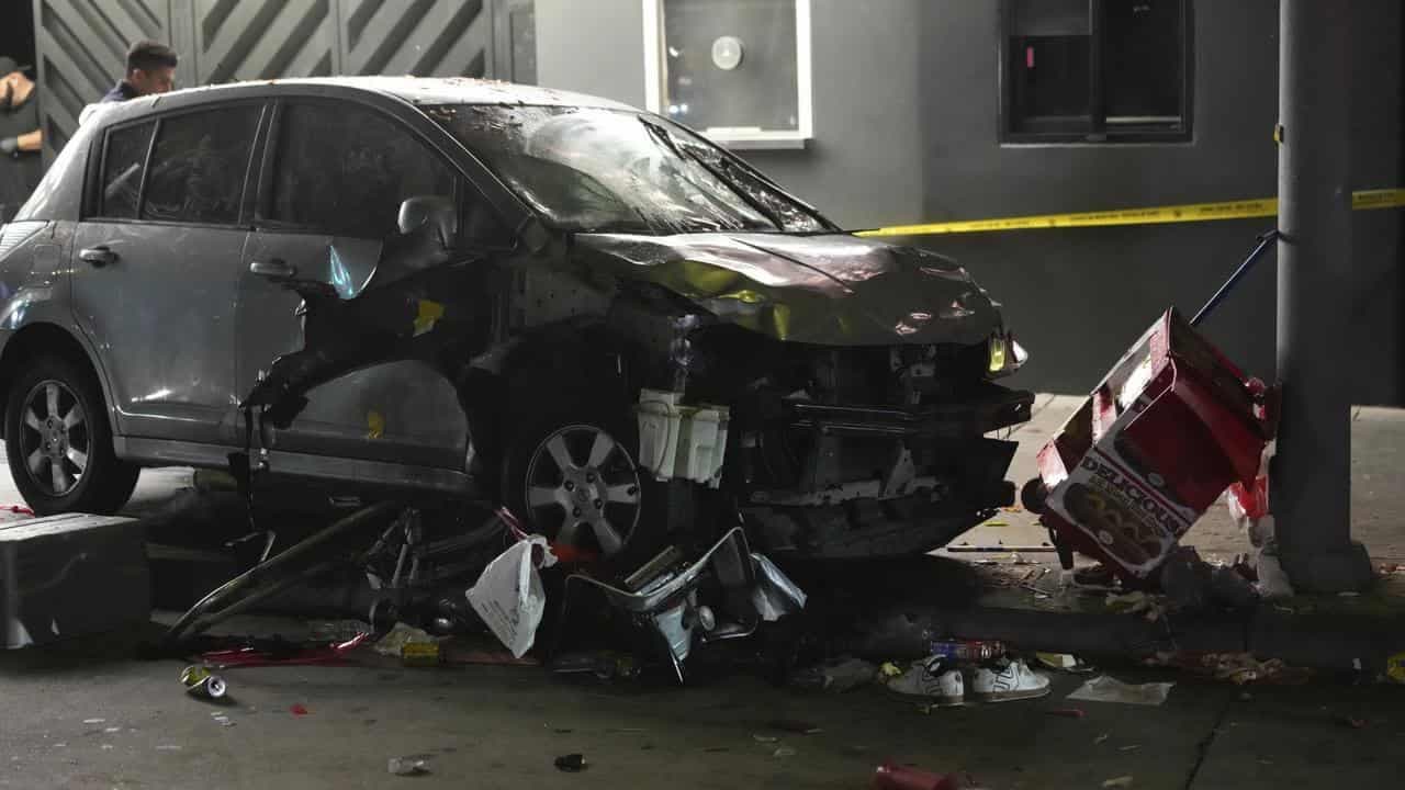 Man whose car hit US crowd was shot, attacked: police