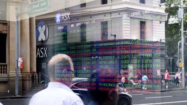 Australian shares higher as central bank cuts rates