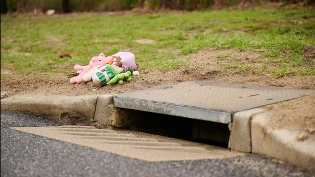 Mother charged after dead baby found in storm drain