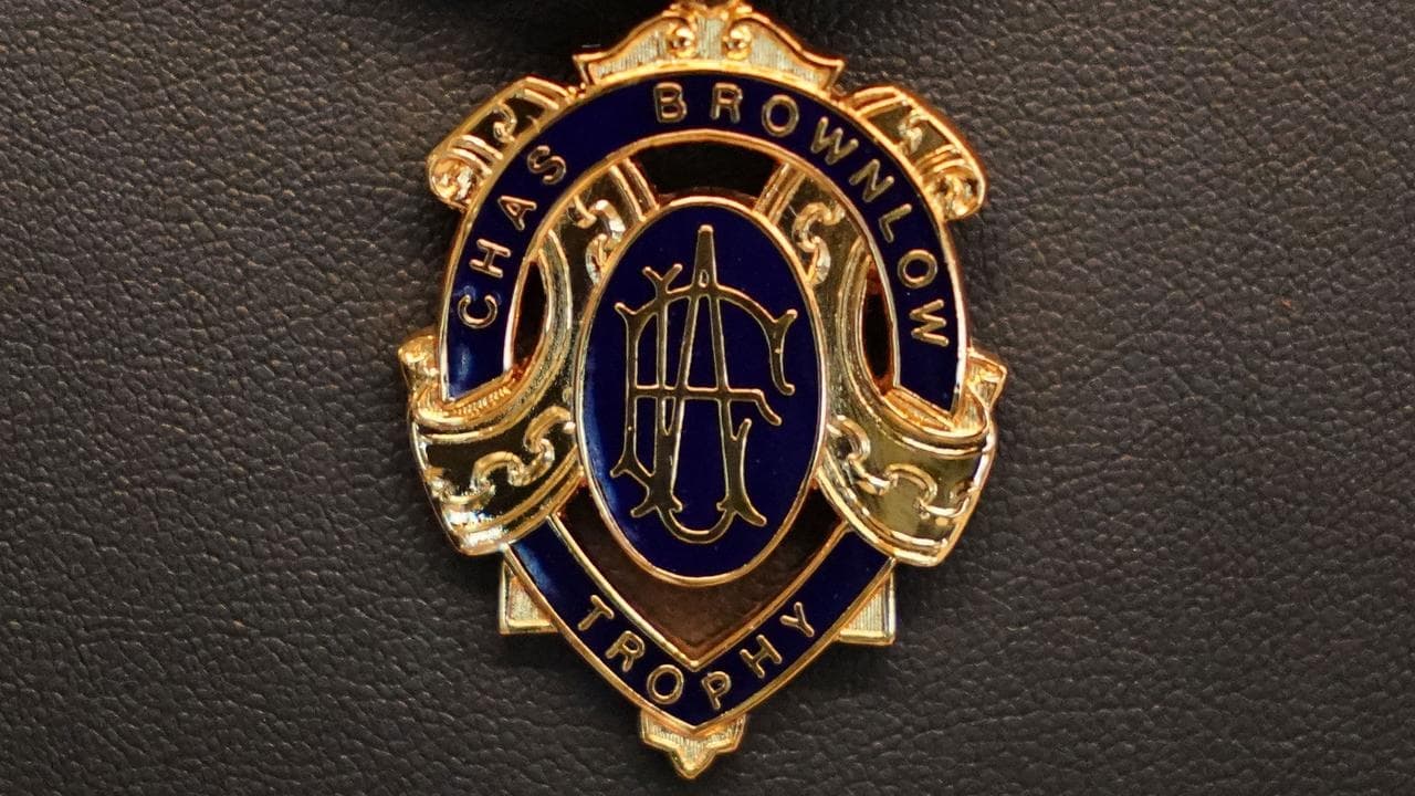 Four men charged after Brownlow Medal betting scandal