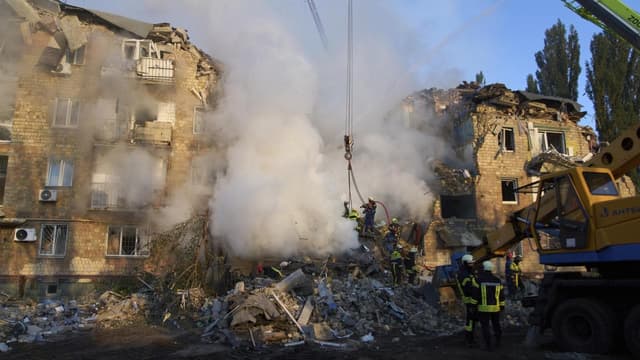 Russian barrage kills 18 in Kyiv, damages EU mission
