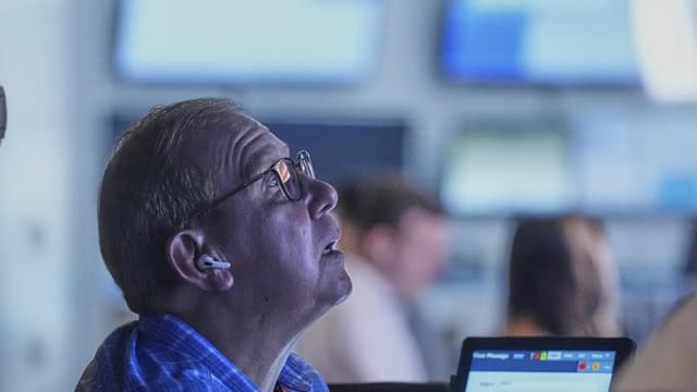 Wall Street ends lower as tariff ruling raises worries