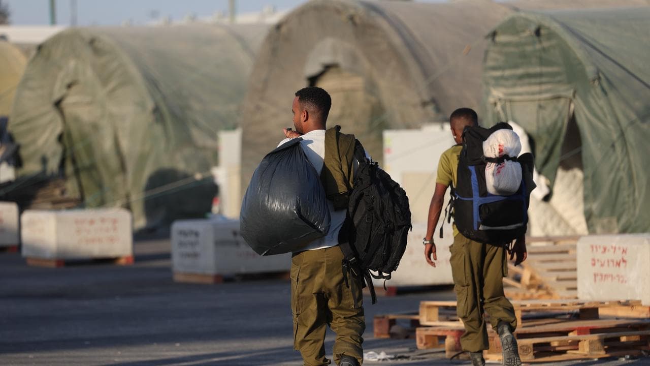 Reservists report for duty, Netanyahu accelerates push