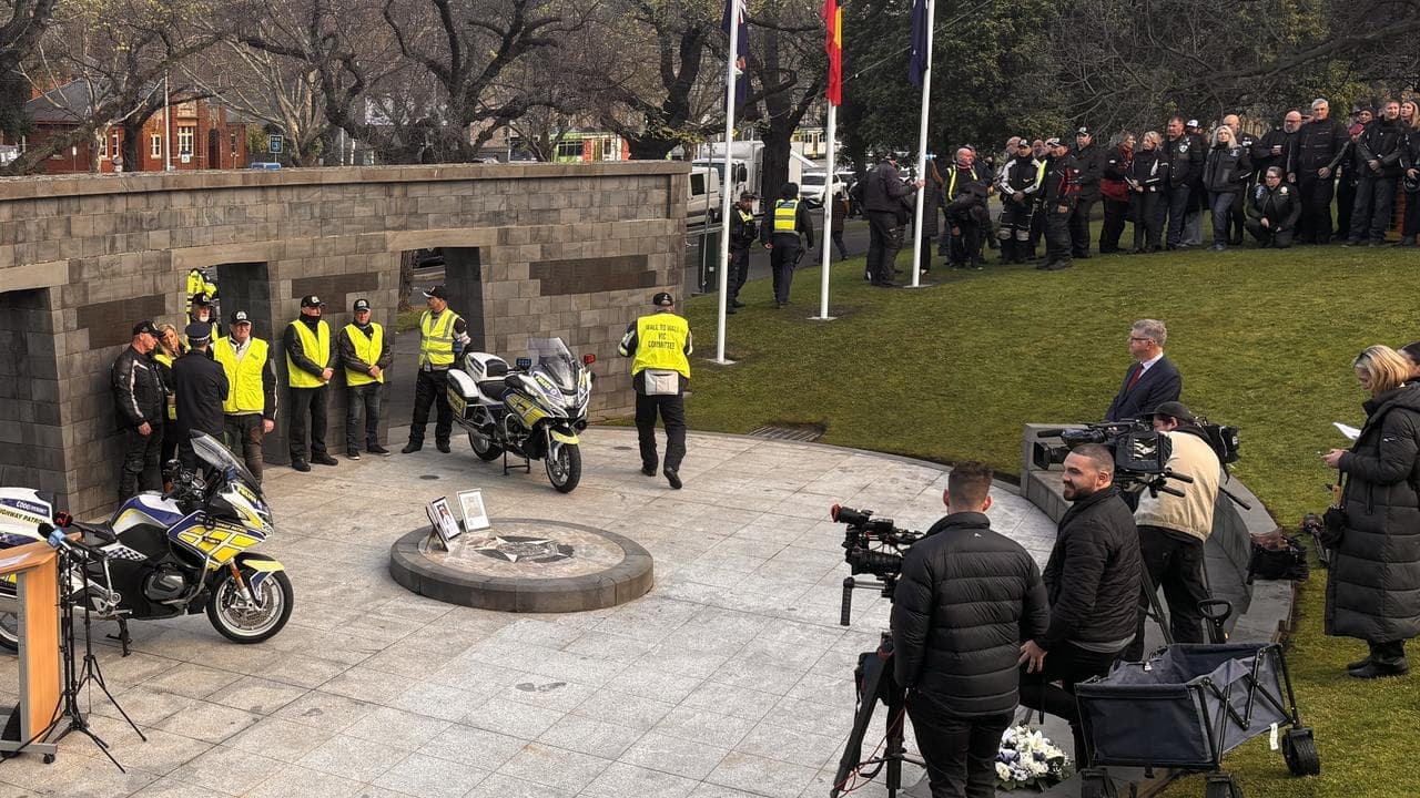 Police honour slain officers as manhunt continues